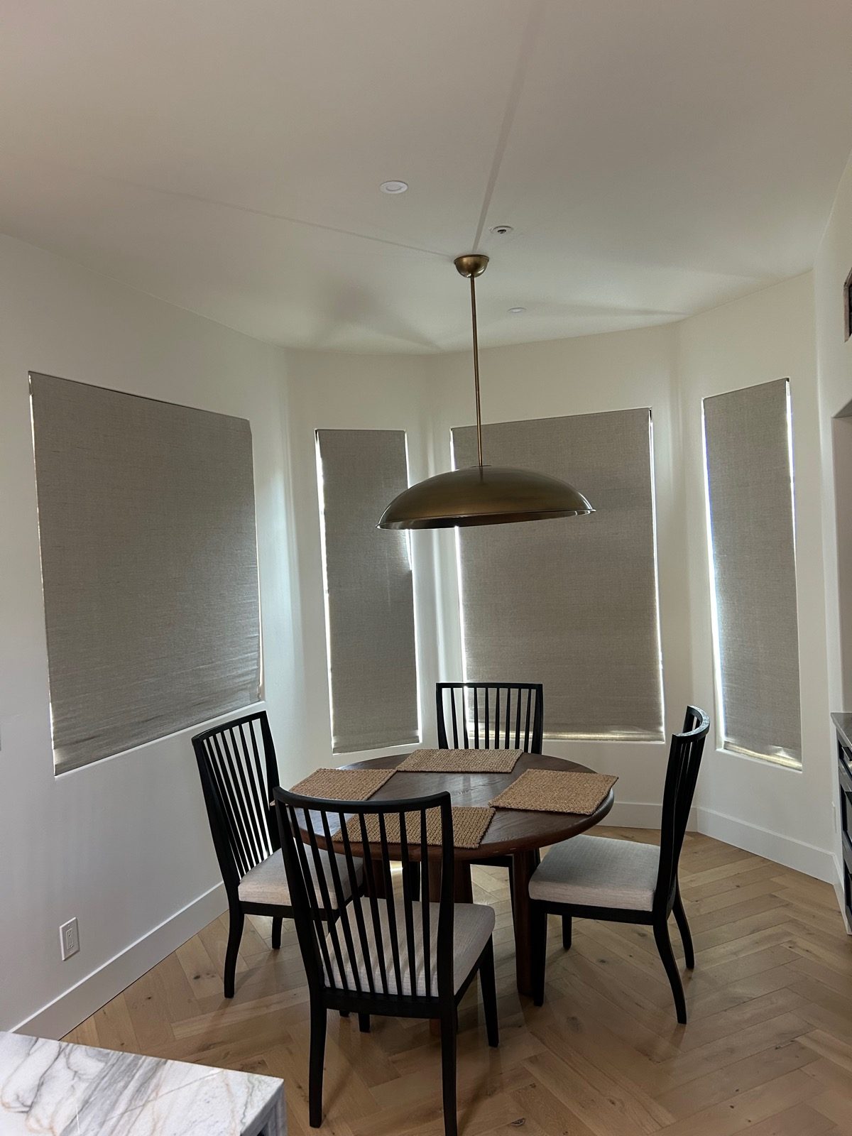 Custom roller shades in a Tucson dining nook