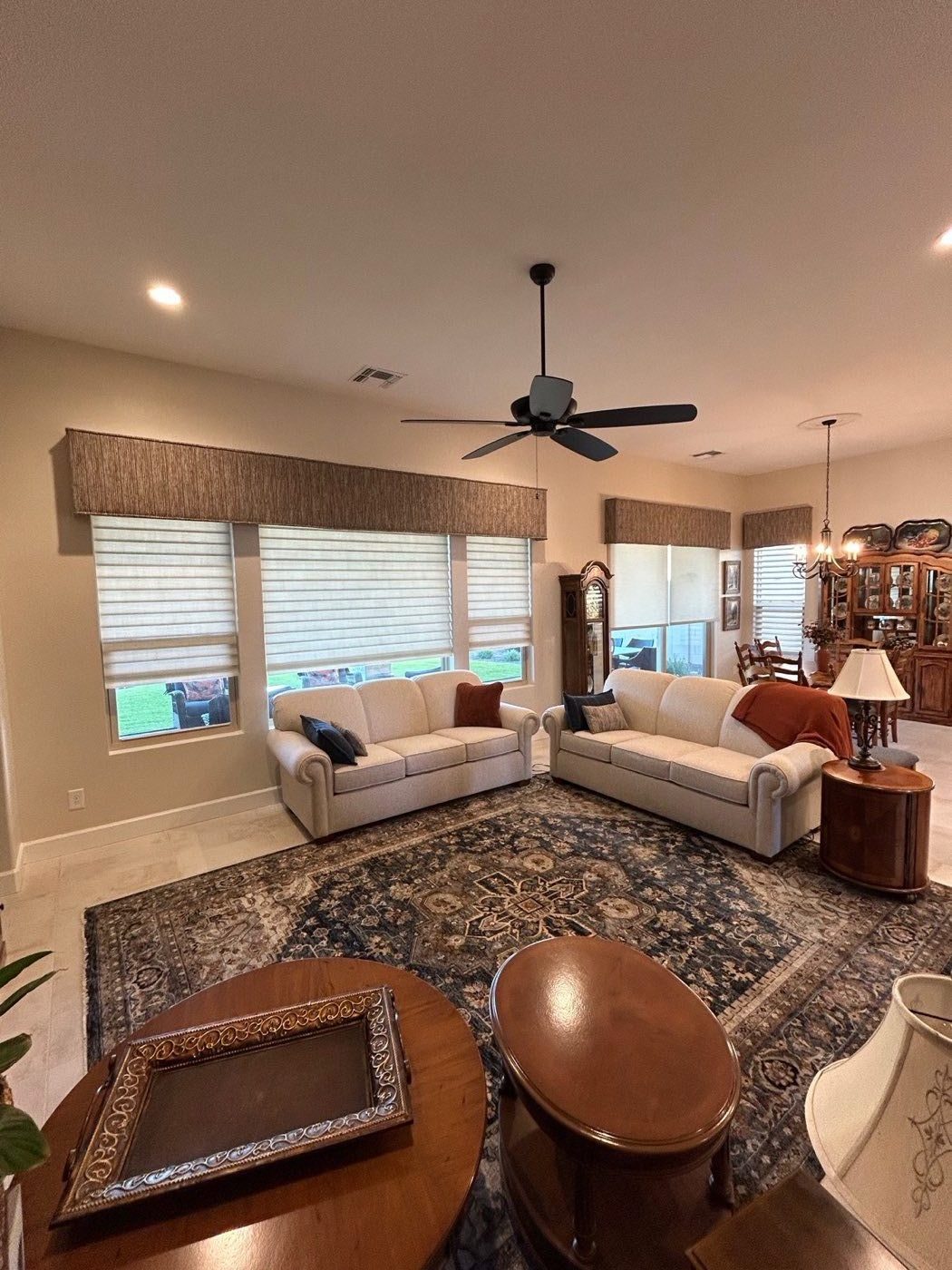 Roman shades with custom fabric cornices in a Tucson living room