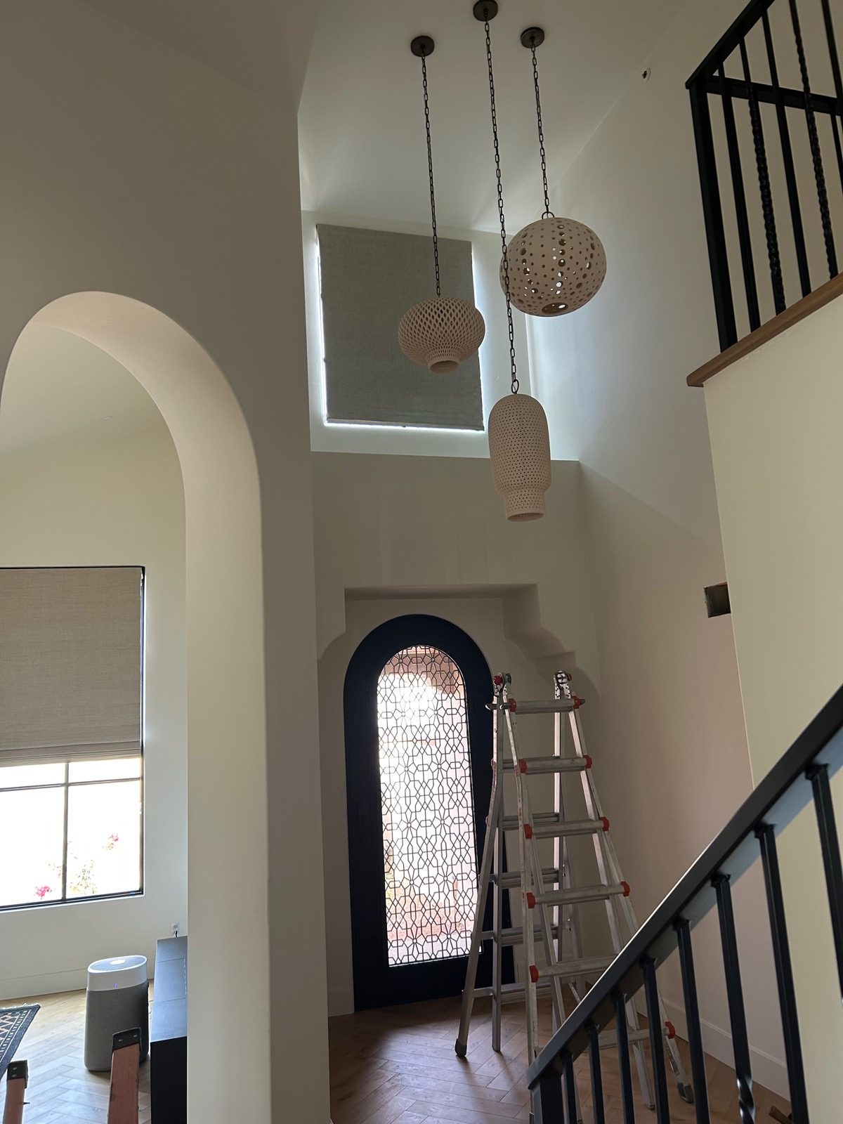 Roman shades in a two-story Tucson entryway