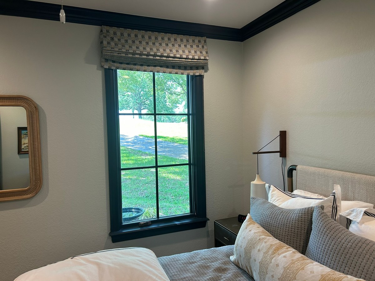 Roman shades in a bedroom by Love Is Blinds Arizona