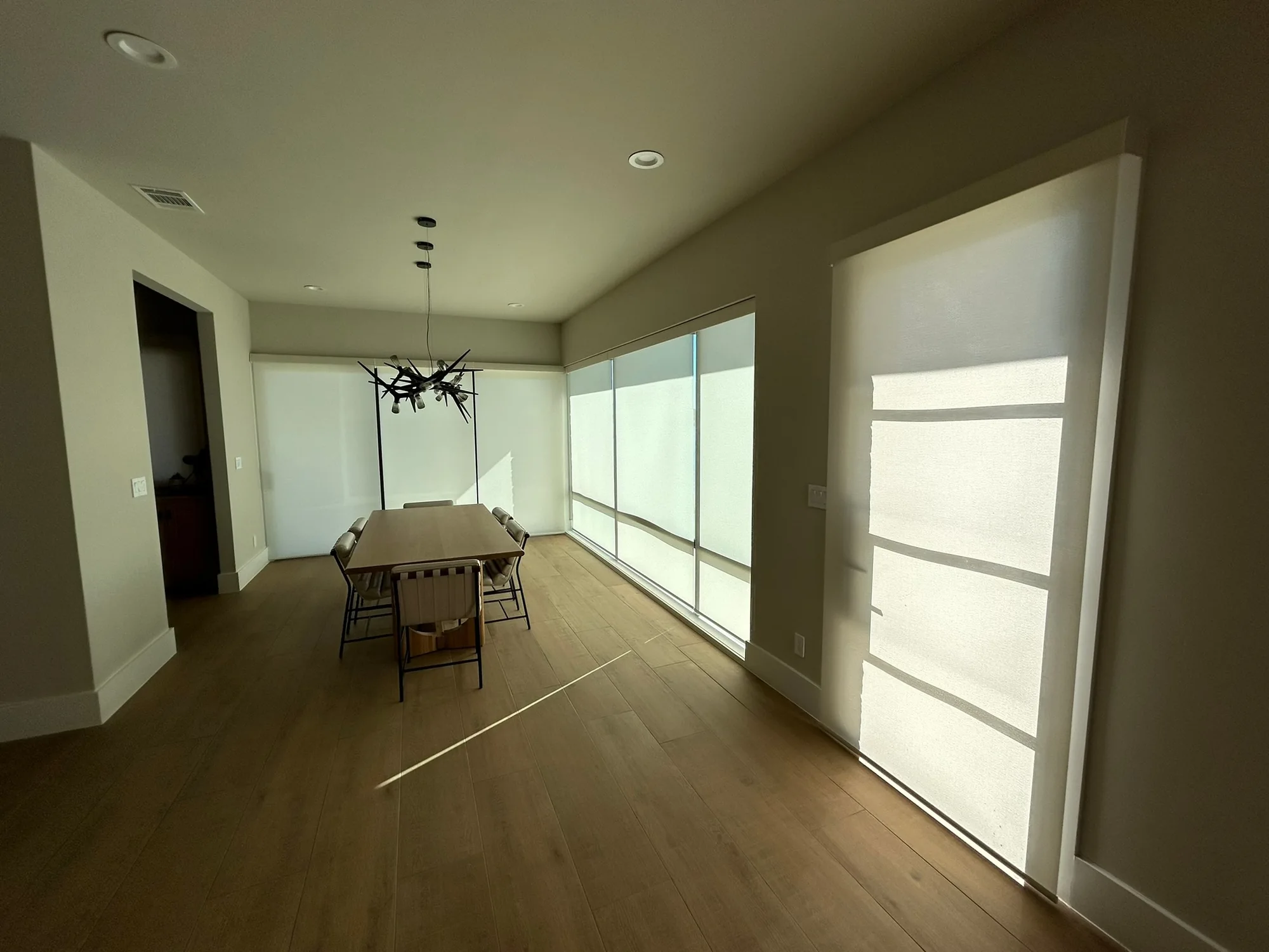Wall of light-filtering shades installed by Love Is Blinds