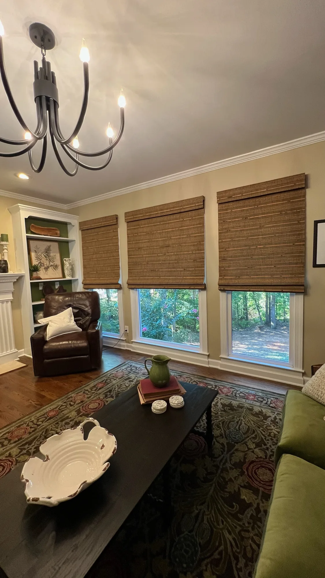 Living room with woven wood shades installed by Love Is Blinds